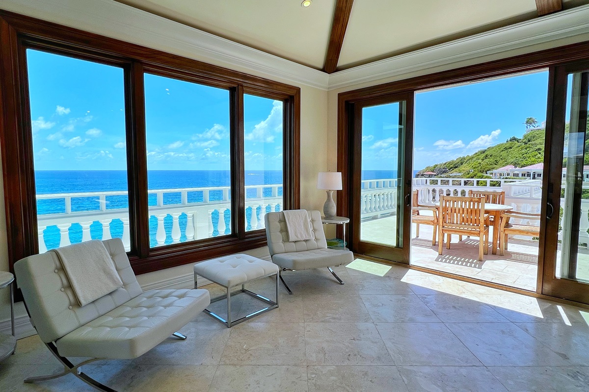 Marvel at the endless blue horizon from your private terrace.