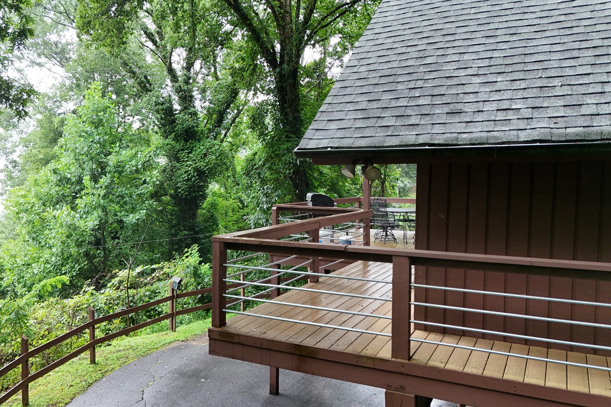 Deckside serenity: Unwind and enjoy the peaceful forest views from your private deck. 