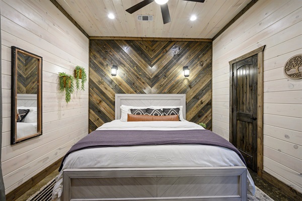 Stunning chevron wood accent wall in a designer king-sized suite.