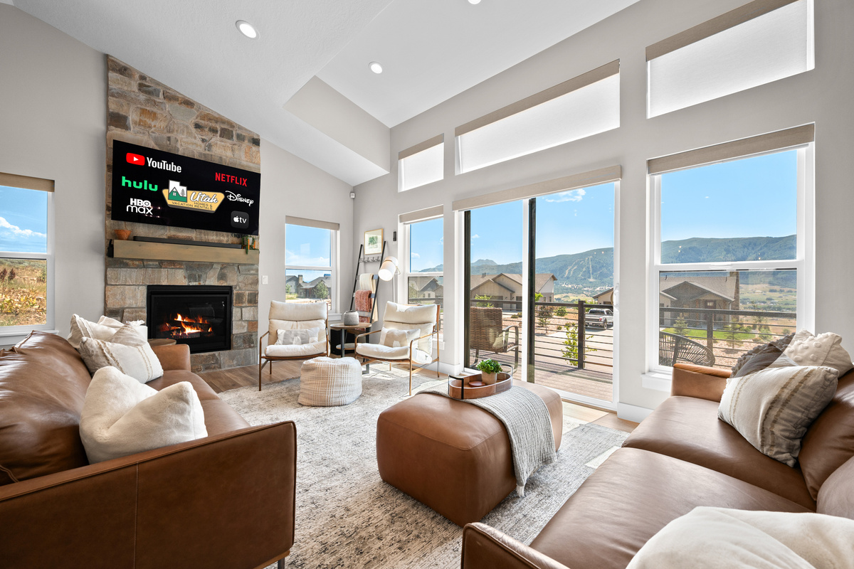 Relax beside the cozy fireplace while enjoying panoramic mountain views and your favorite movies on the Smart TV.