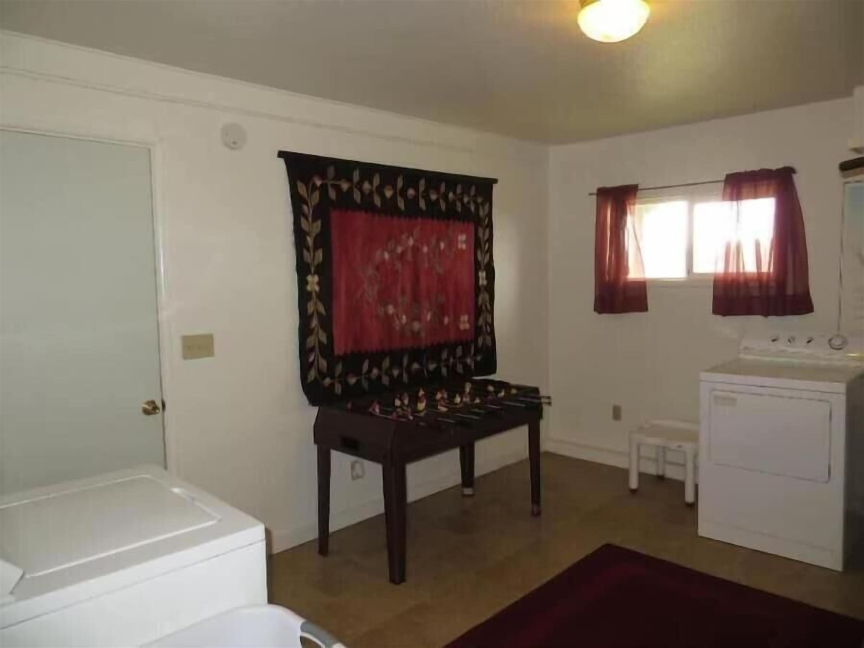 laundry room with foosball