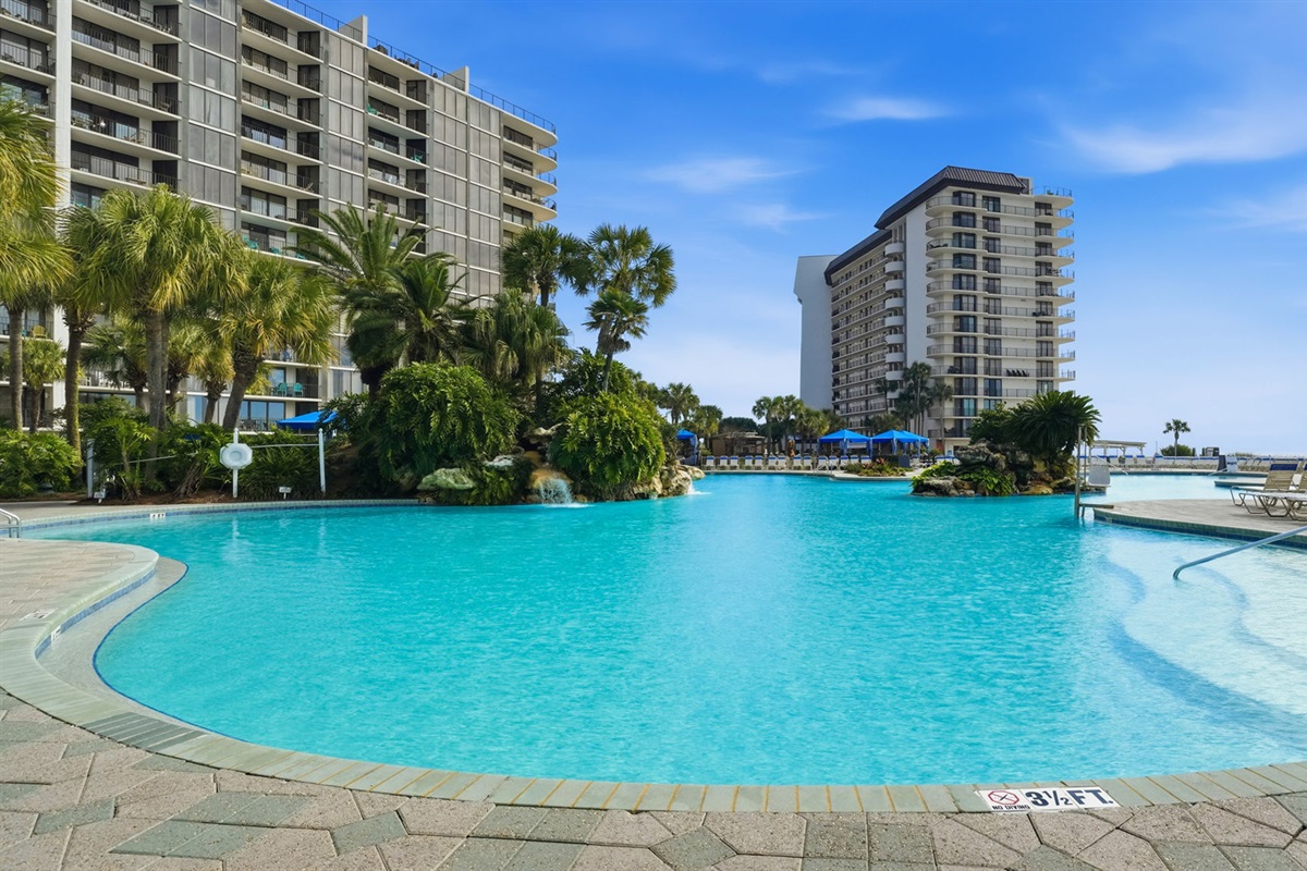 Edgewater's picturesque lagoon-style pool designed with true relaxation in mind with serene built-in waterfalls