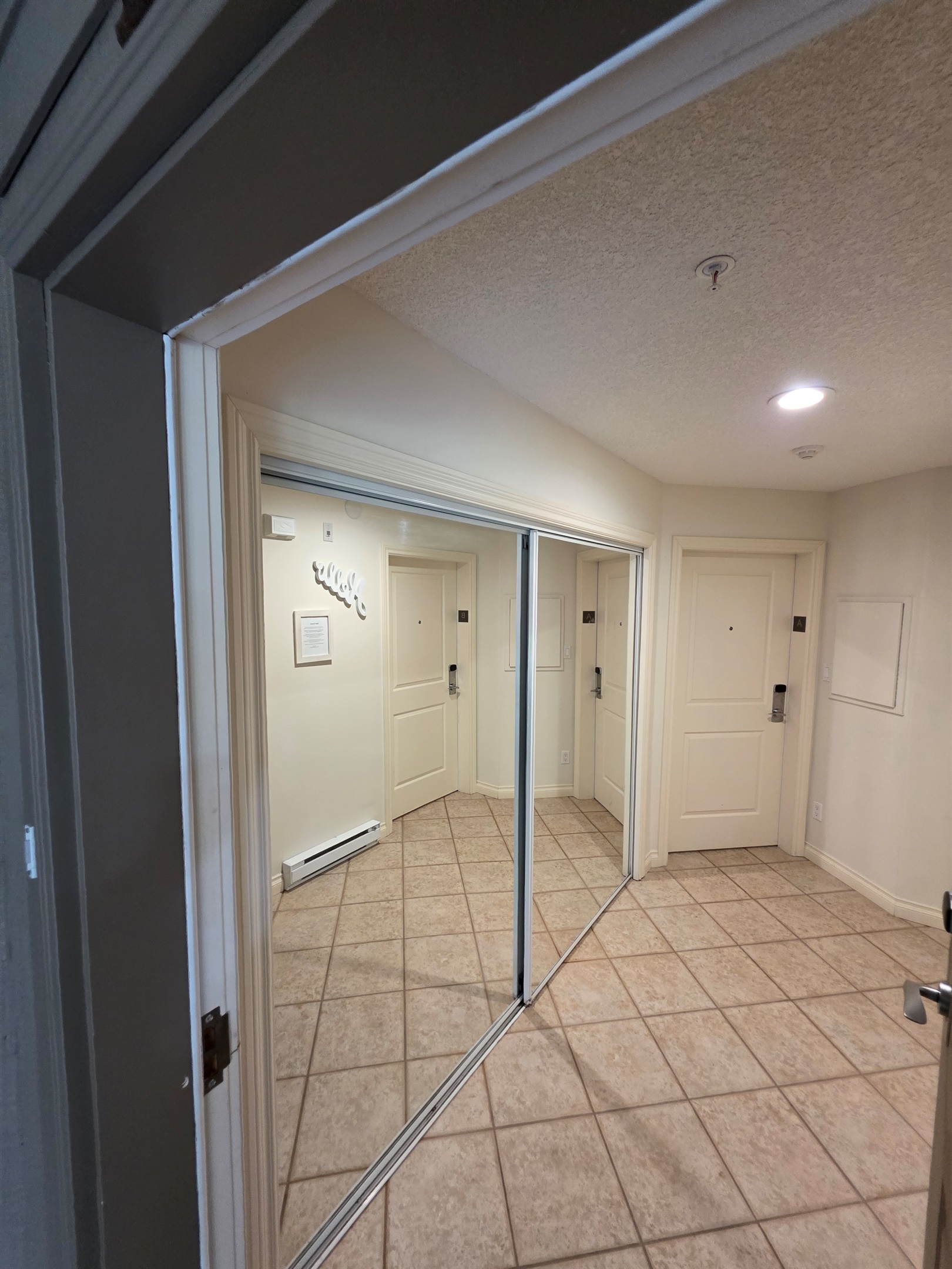 Massive hallway between Unit A and B. Keep the doors open if you rent both Units to move freely between the condos as the hallway is private and secure.