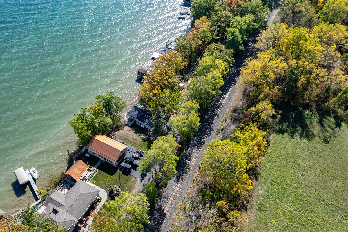 Beautiful lakefront property tucked among trees, offering both privacy and panoramic views.
