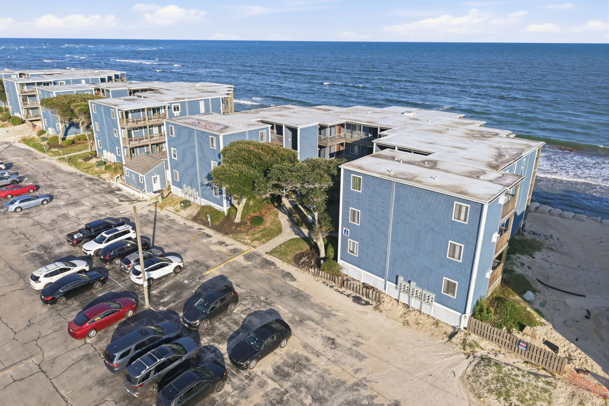Take in the beauty of North Topsail Beach from above, with sweeping views of the shoreline, ocean waves, and the unique location of this quiet oceanfront retreat