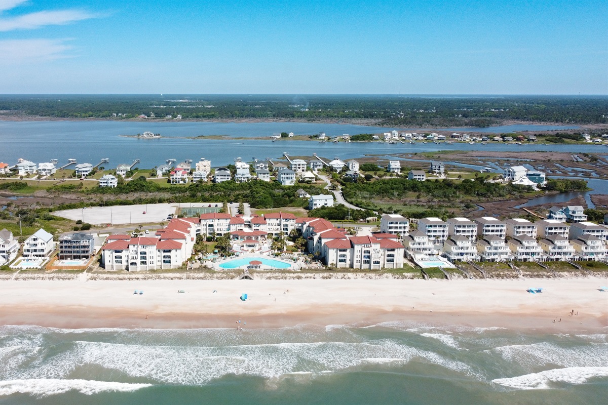Coastal community stretches along a pristine beach