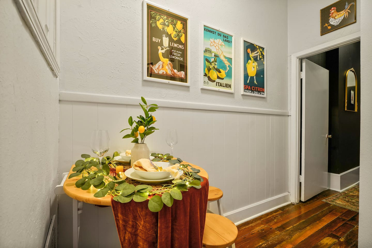 Your citrus-themed kitchen has a small table with two stools for coffee or a meal. For larger gatherings, head to the living room couches or backyard picnic tables with your whole group.