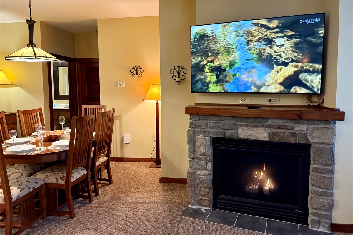 The gas logs will keep you warm when it's cold on the mountain.  65" Smart TV.