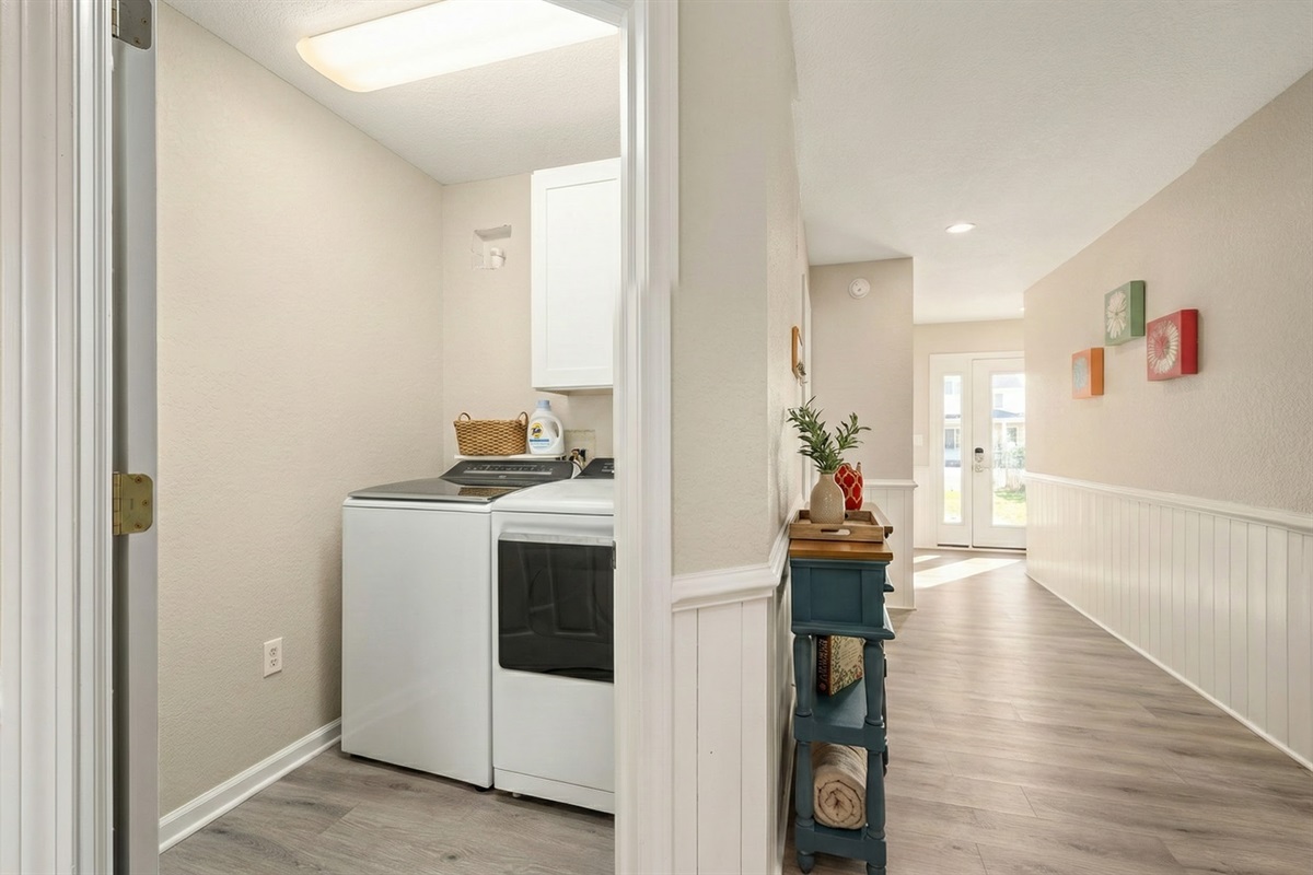 Fully equipped laundry room with modern appliances for your convenience.