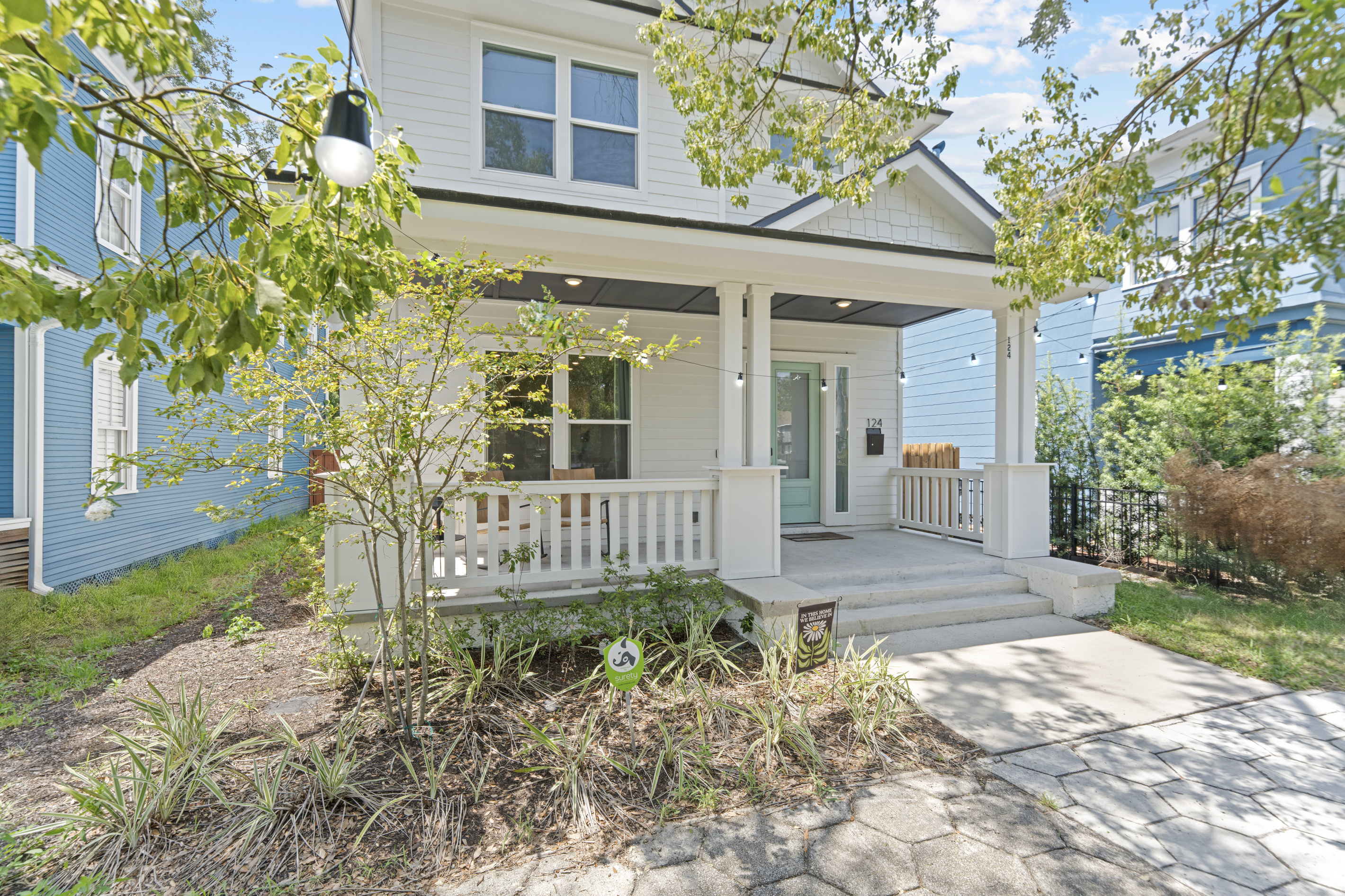 String lights, a place to sit, and a mint green door. This porch is the first thing you will love and the last place you will sit each night, watching the historic neighborhood go by and letting the evening take its time.