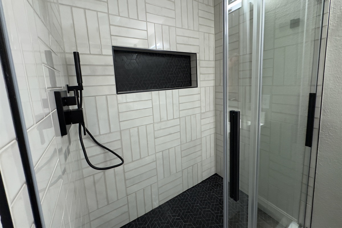 Beauty and the Beast Master Suite Shower with Custom Tile and Rain Shower.