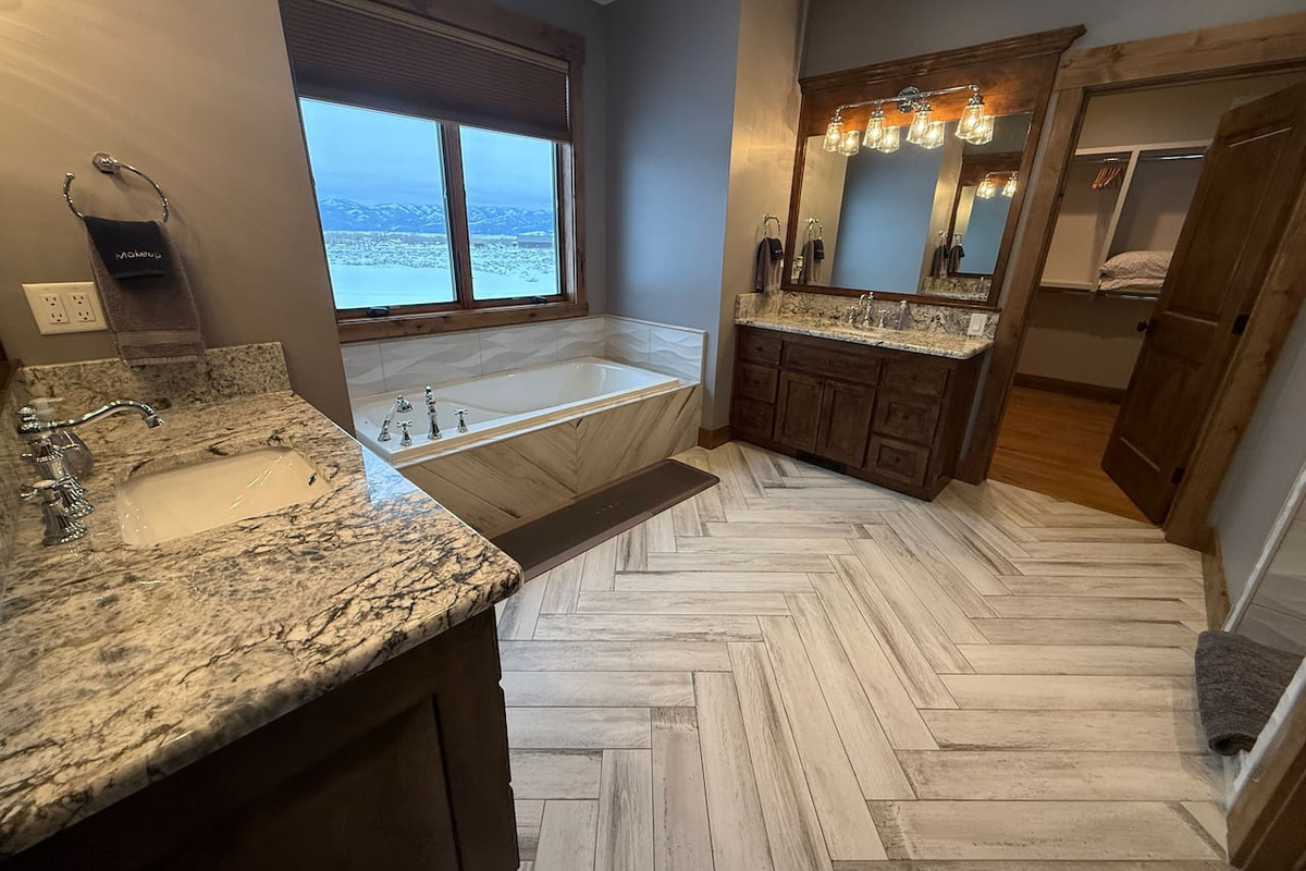 master bathroom with walk in shower and standalone soaking tub