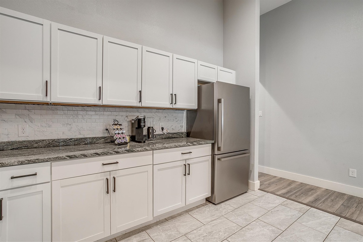 White cabinets and clean finishes for a polished cooking experience.