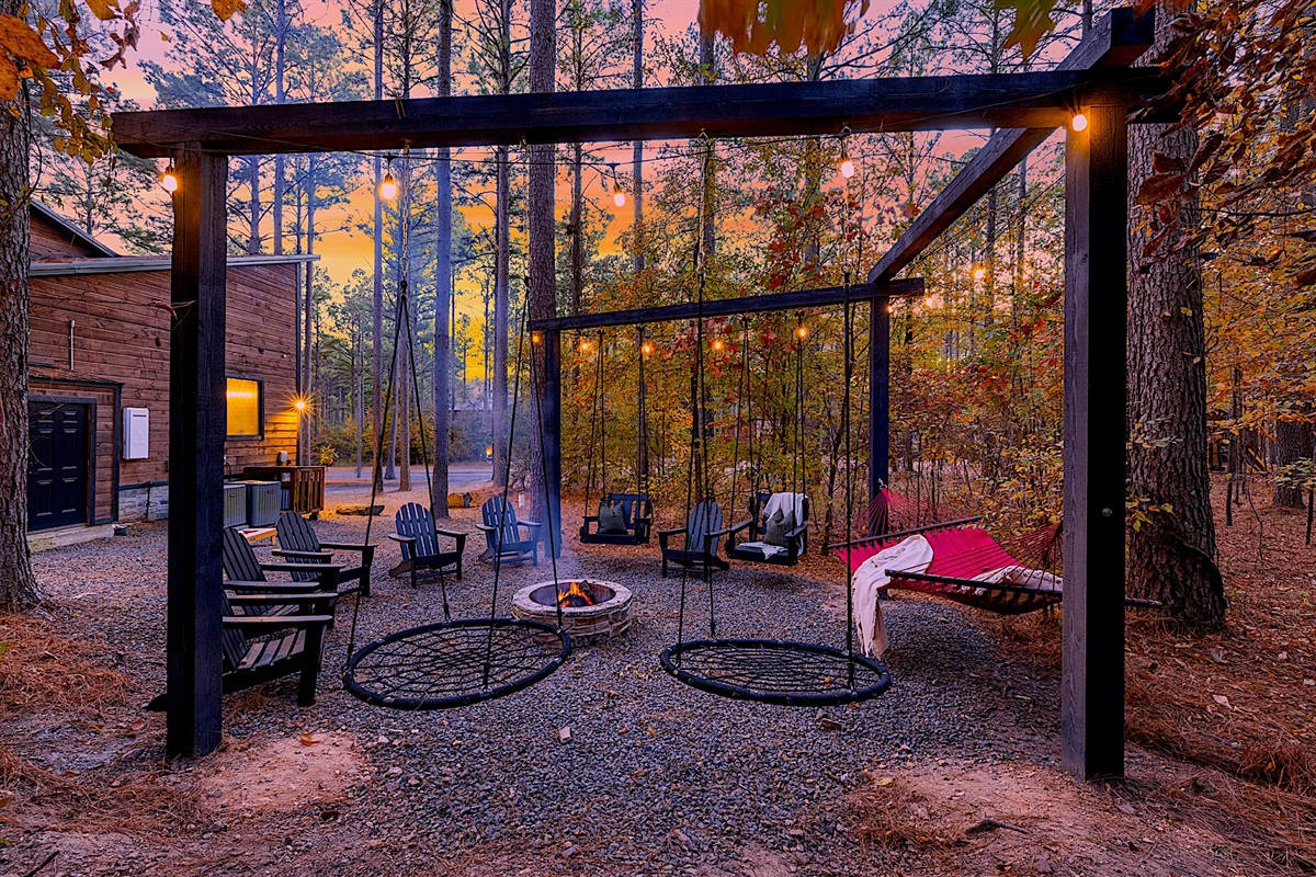 Ample seating and swings by the firepit