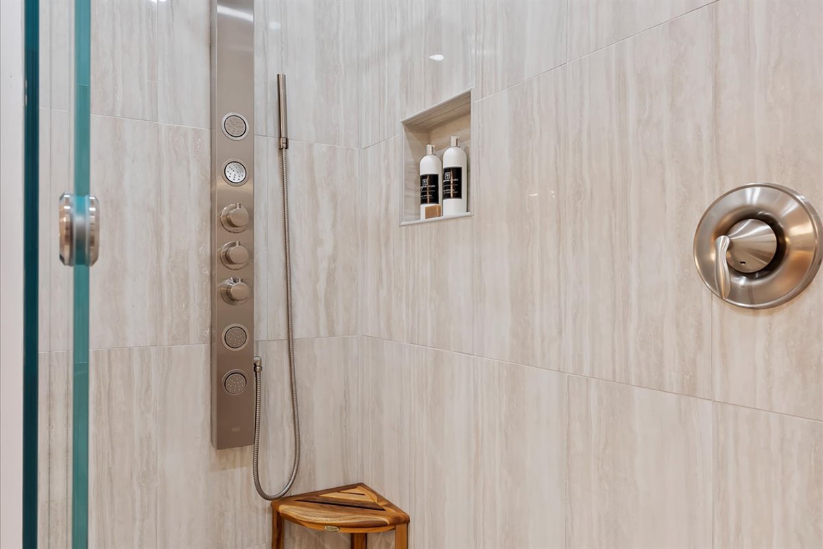 Thoughtfully designed for a rejuvenating, spa-like escape with multiple spray options and modern fixtures, this shower offers a luxurious start or end to your day.
