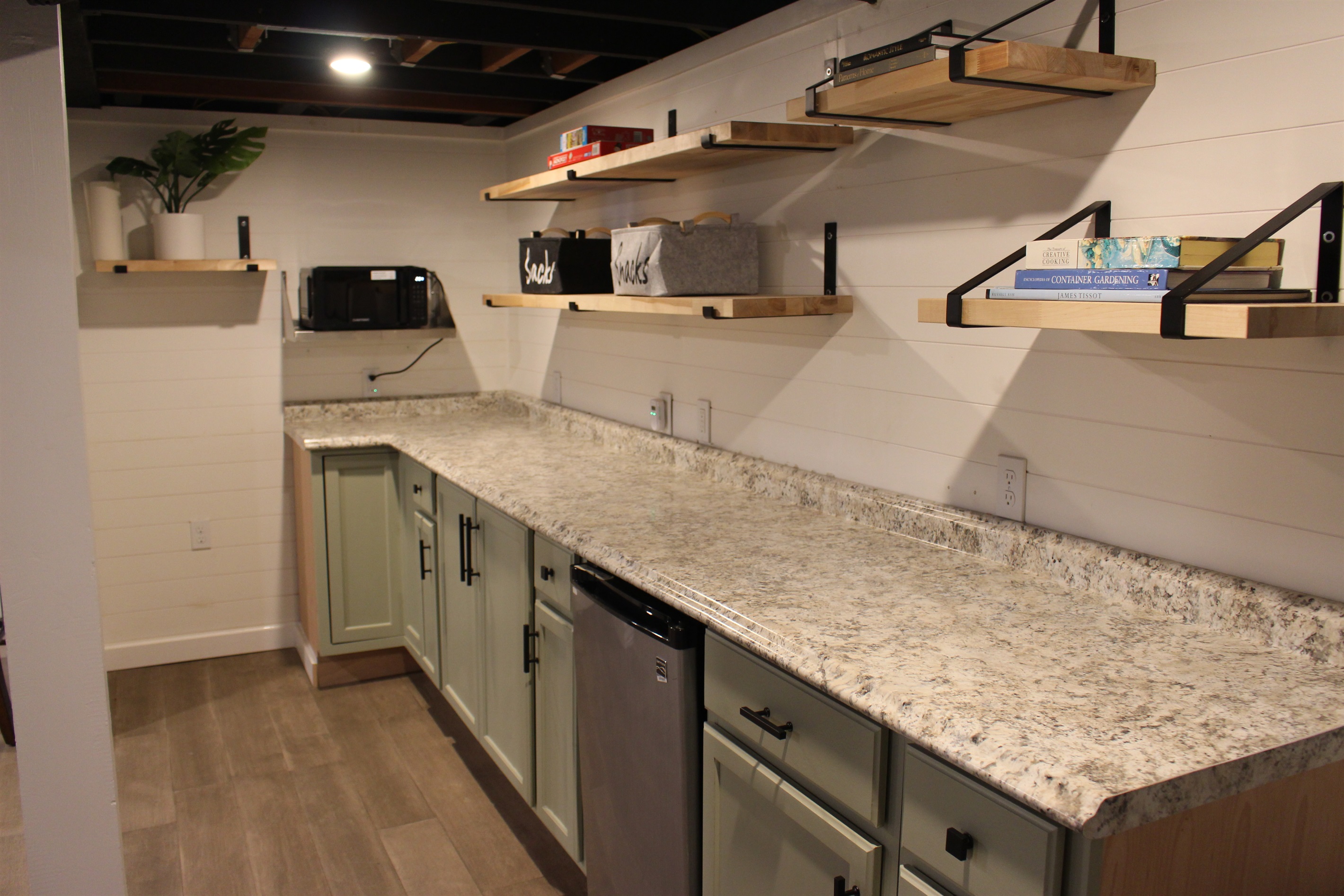 Basement kitchenette with microwave and minifridge