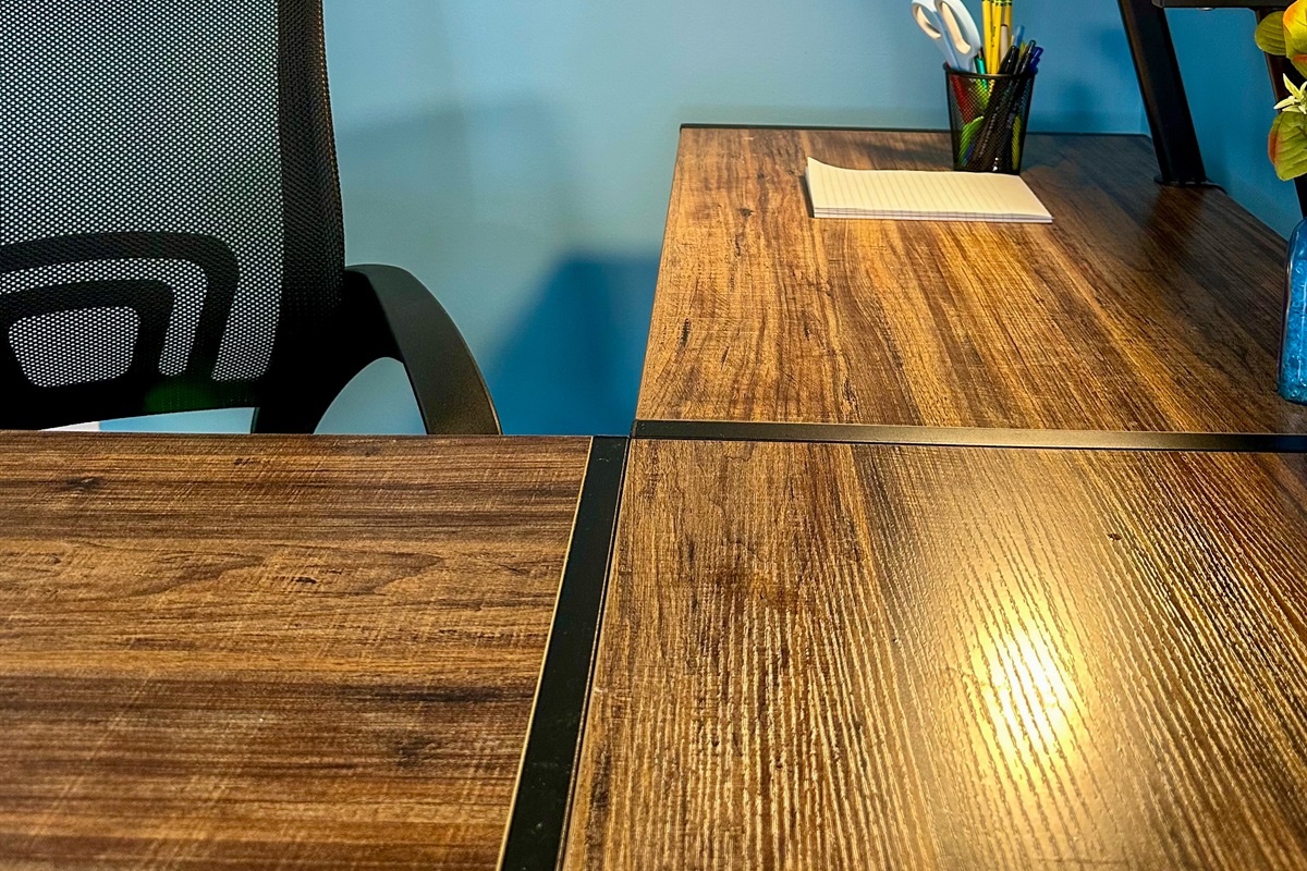 Workspace detail featuring a notepad and organizer stocked with pens, pencils, and scissors—thoughtfully provided for guest convenience, whether catching up on work or jotting down plans during your stay.