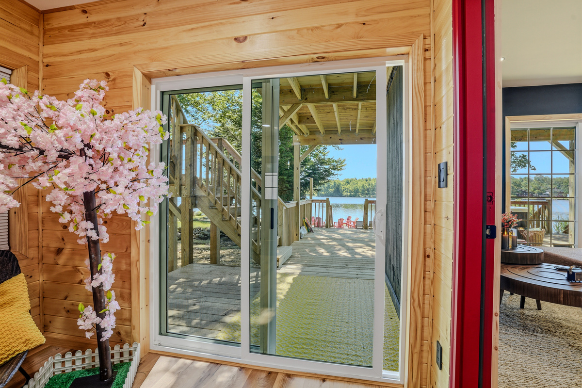 Lower-level sliding door with cherry blossom décor and lake view straight ahead