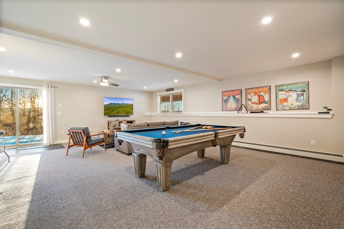 Your Entertainment Hub: Full-size pool table and room to relax after a day on the mountain.