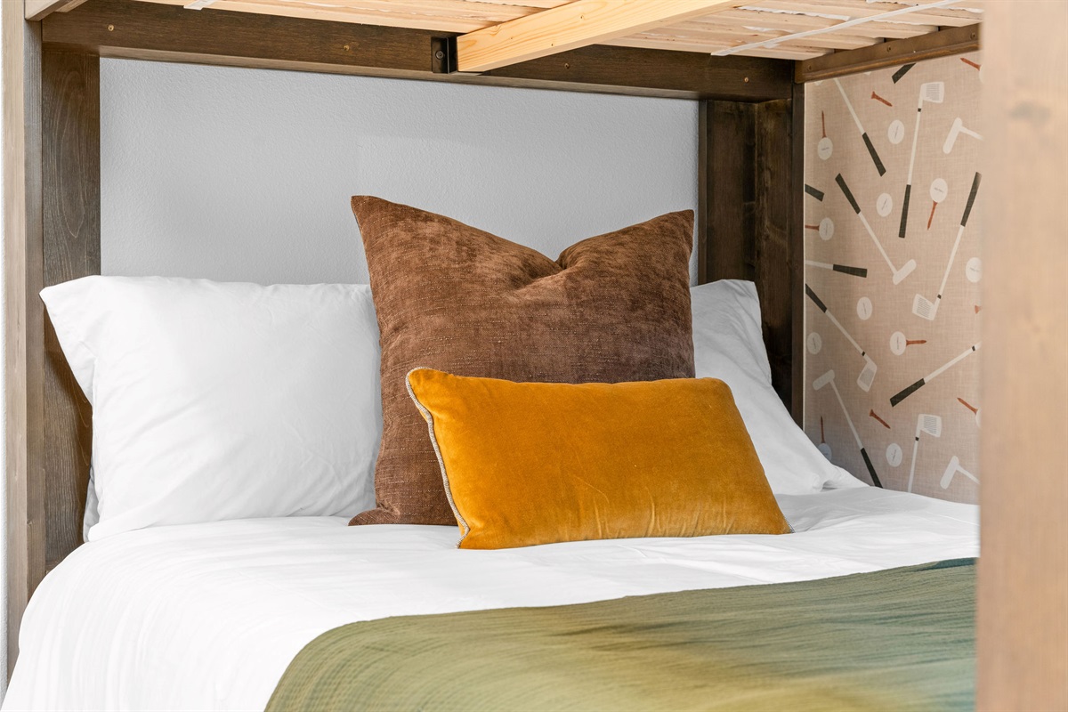 Comfortable bunk bed setup with warm, inviting touches.