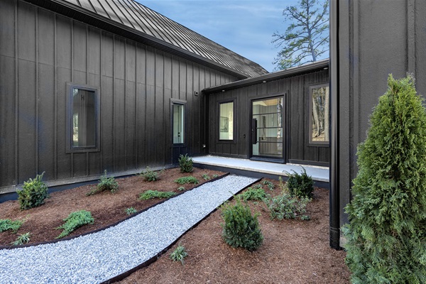 This thoughtfully landscaped entry path leads you through the courtyard and into the heart of your home away from home.