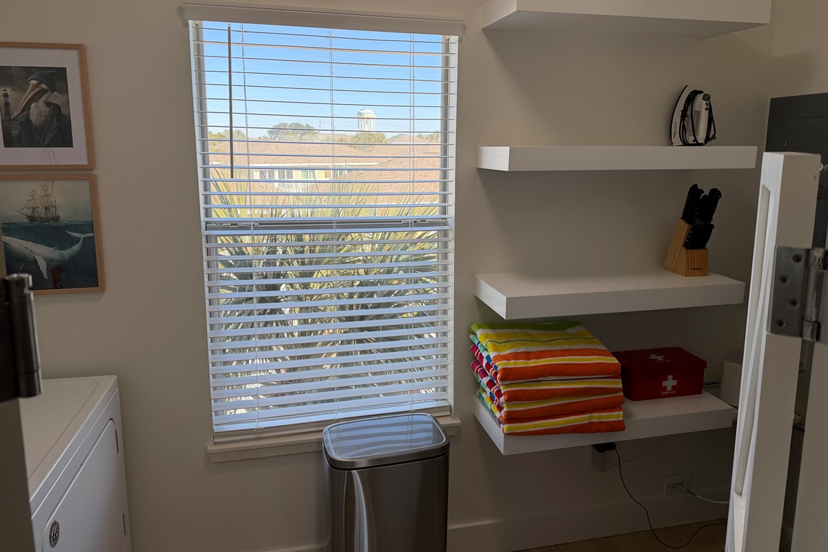 Floating shelves in the laundry room provide plenty of storage room!