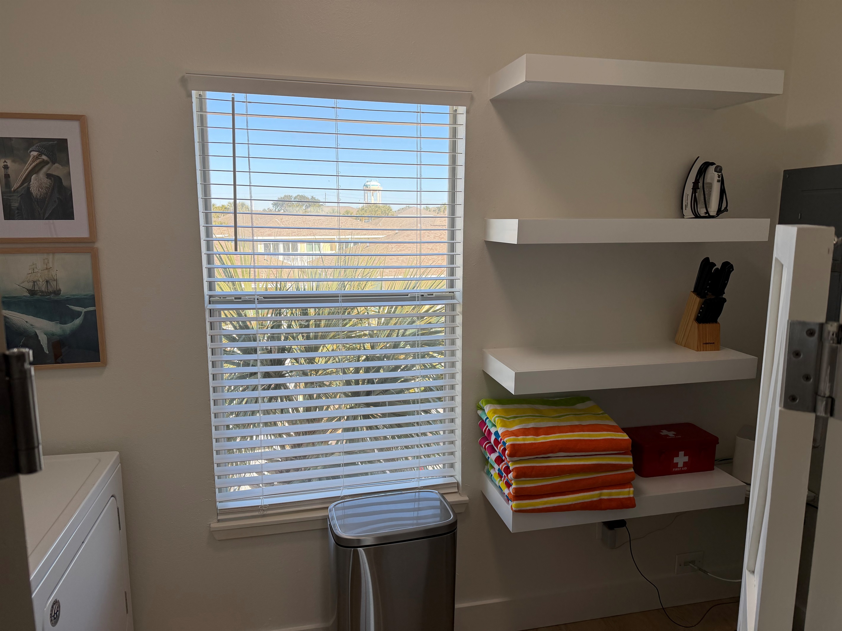 Floating shelves in the laundry room provide plenty of storage room!