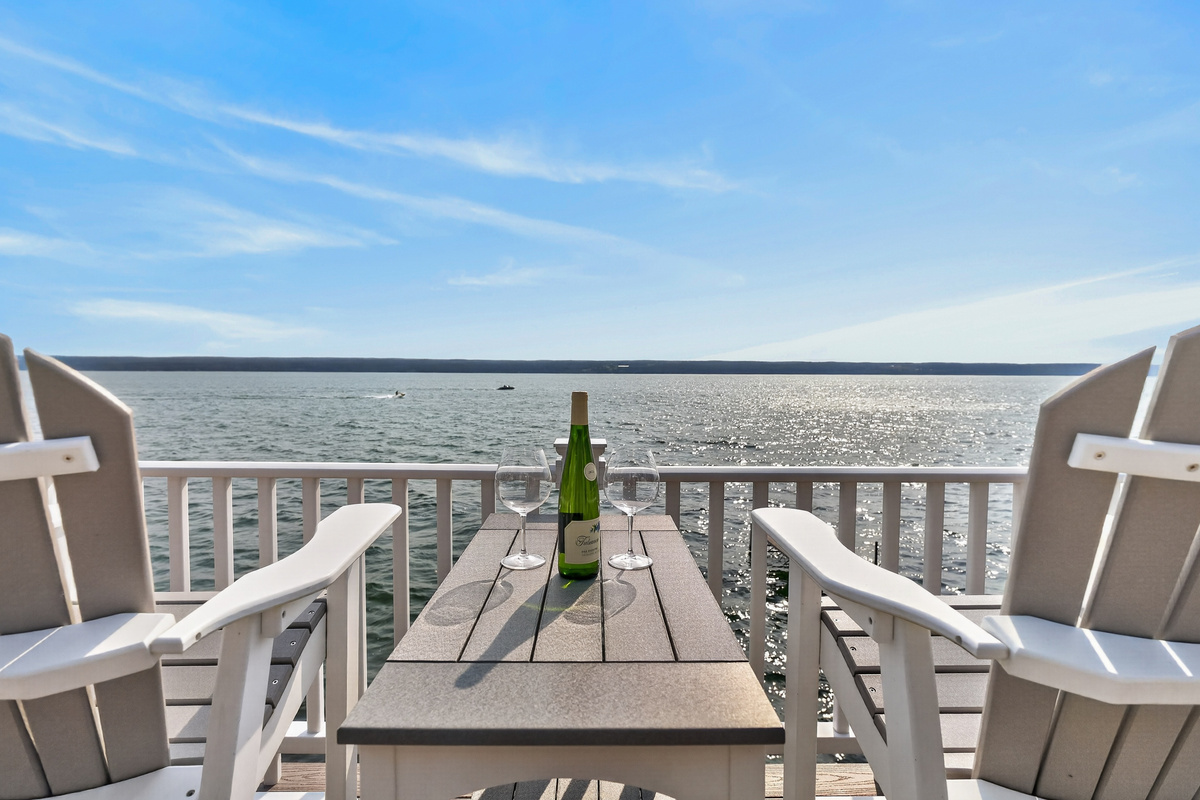 Waterfront table with Adirondack chairs