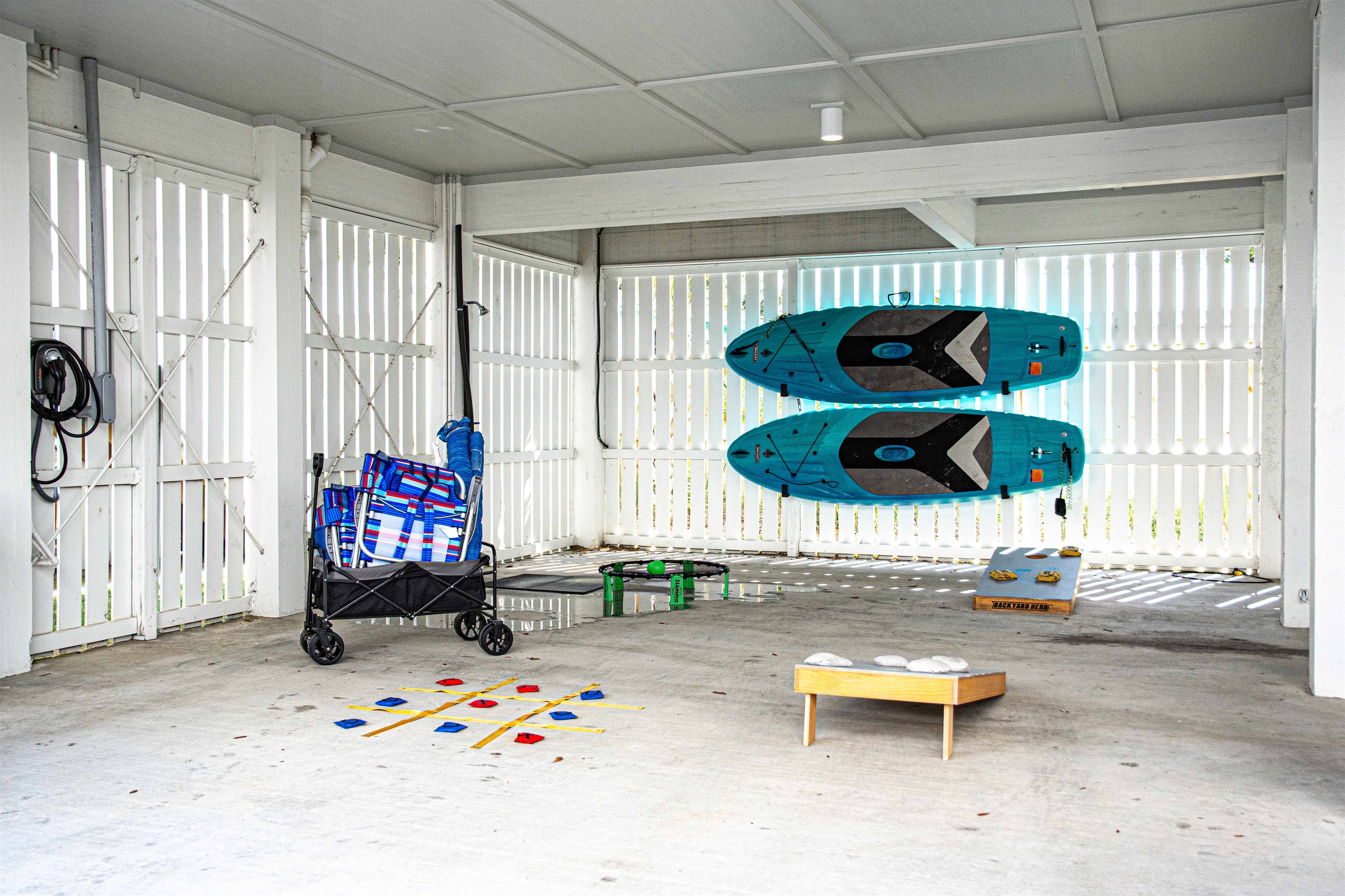 Everything you need! Beach chair, umbrellas, paddleboards, wagon, corn hole, tic tac toe, spike ball! We have you covered. Get a tourny going with everyone!