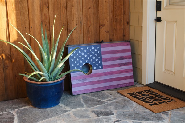 Seasonal potted flowers, plants, or decor near the garage entrance add a welcoming touch to the arrival experience.