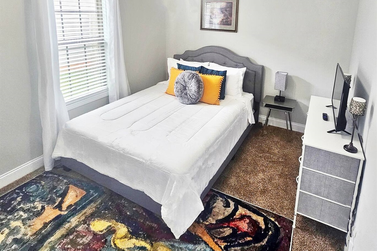 Enjoy this simple and calming guest queen bedroom. Perfect for 2. 
Full-length mirror & closet space.