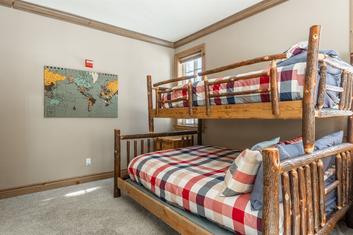 The Nest's thoughtfully designed bunkroom with a twin-over-queen bunk, window seat, and a cozy layout that kids or adults will love.