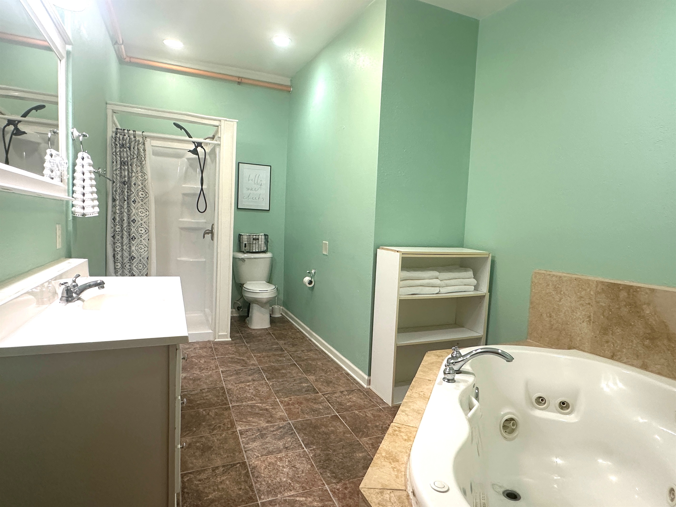 The bathroom offers a jetted tub for two!