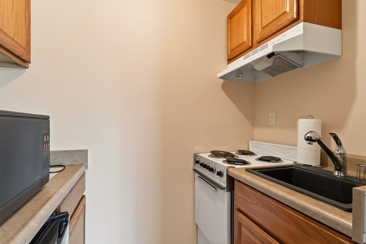 Compact kitchenette with stovetop and sink