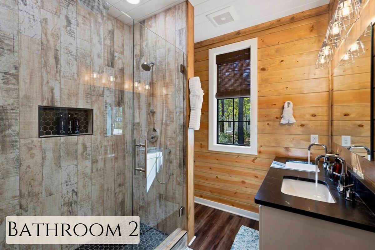 This bathroom brings a touch of modernity to the wilderness, offering a refreshing shower experience