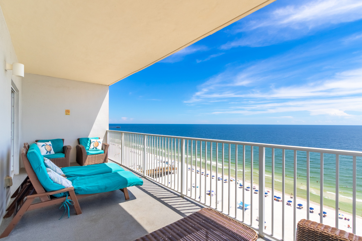Private beachfront balcony with panoramic Gulf and shoreline views.