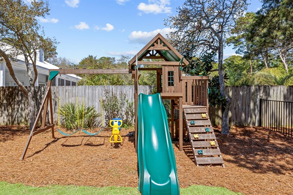 A backyard build for play, soft turf, a swing set, and a space place for the little ones to burn off energy.
