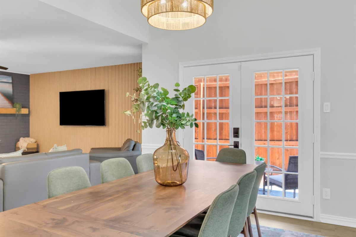 Enjoy the open concept living in this dining area that seats 8 with perfect TV views