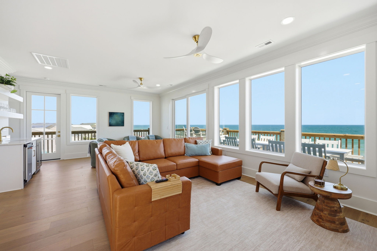Open-concept coastal kitchen built for hosting large groups with premium finishes and natural light throughout