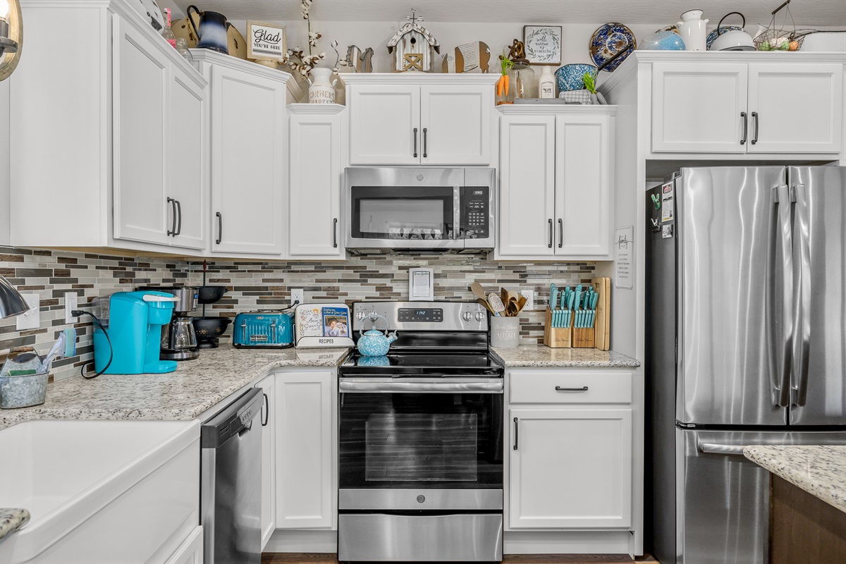 Fully furnished kitchen with plenty of cookware. Regular and Keurig coffee pots.
