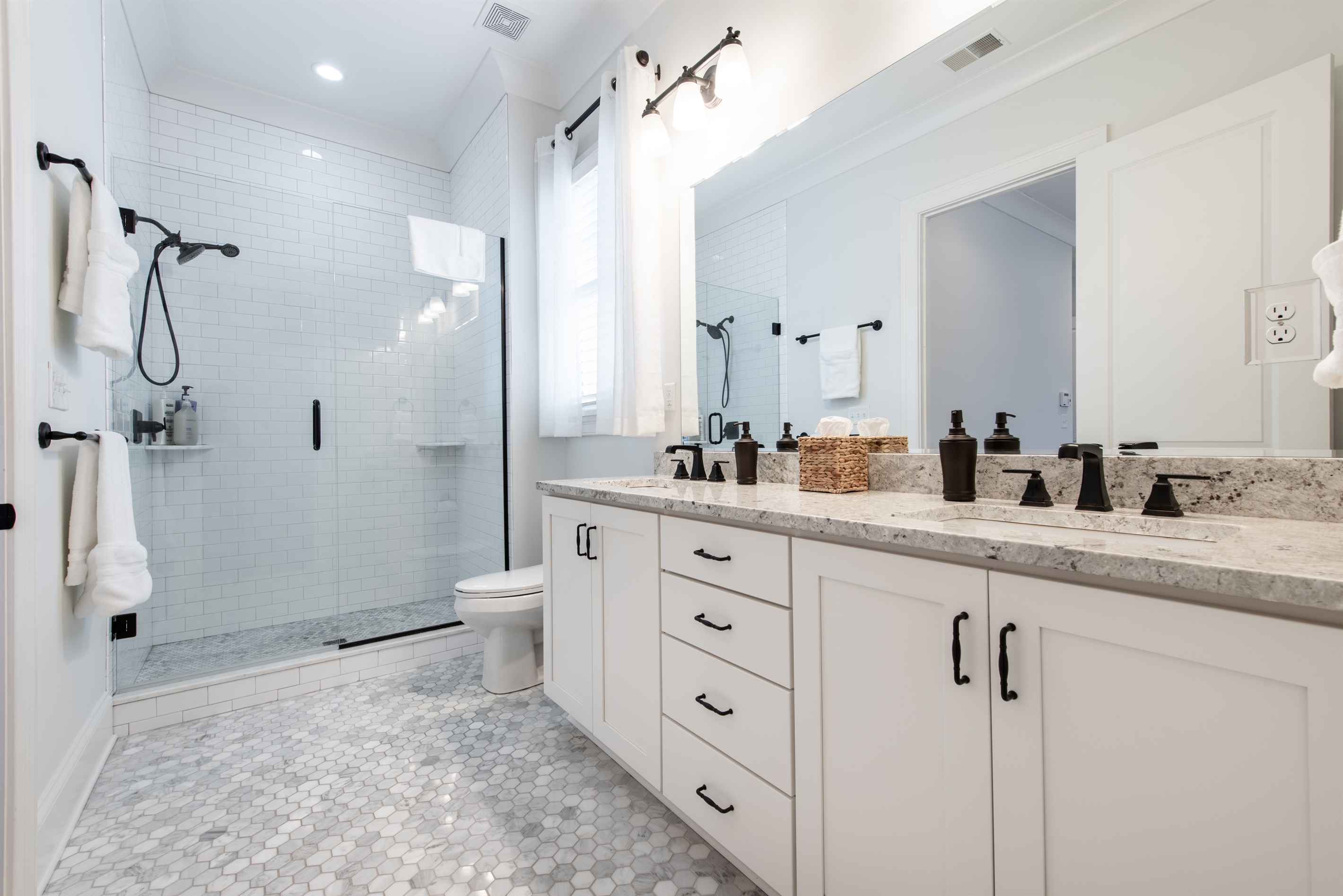 Spacious shower with plenty of room for a relaxing, refreshing experience.