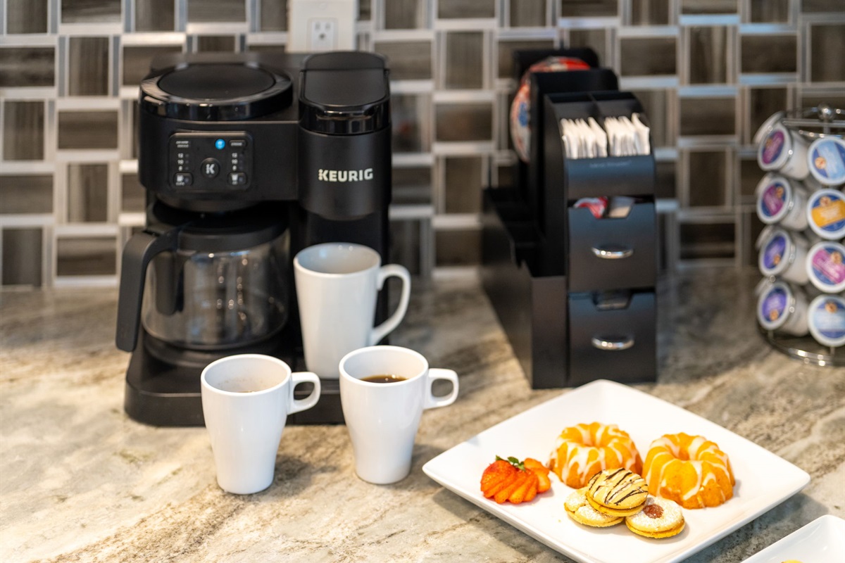 Complete with a dedicated coffee station, this kitchen is a dream for caffeine enthusiasts—stocked with a coffee maker, Keurig, and plenty of mugs.