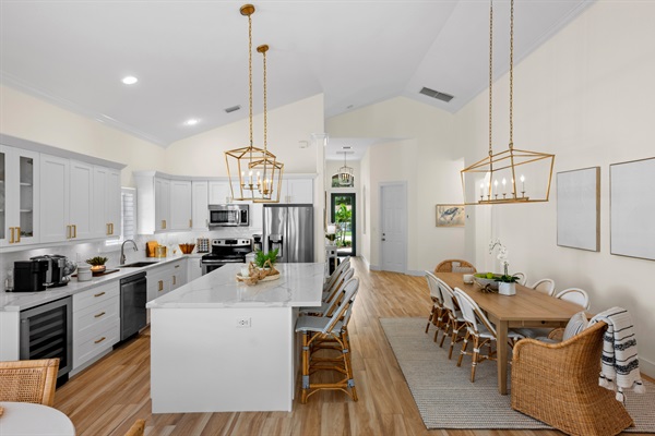 Fully Stocked Kitchen w/ Bar Seating and Two Tables!