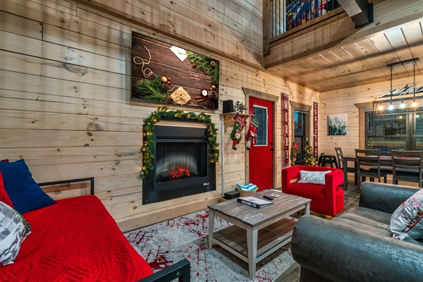 Gather by the fireplace and enjoy festive vibes in this bright, inviting space!