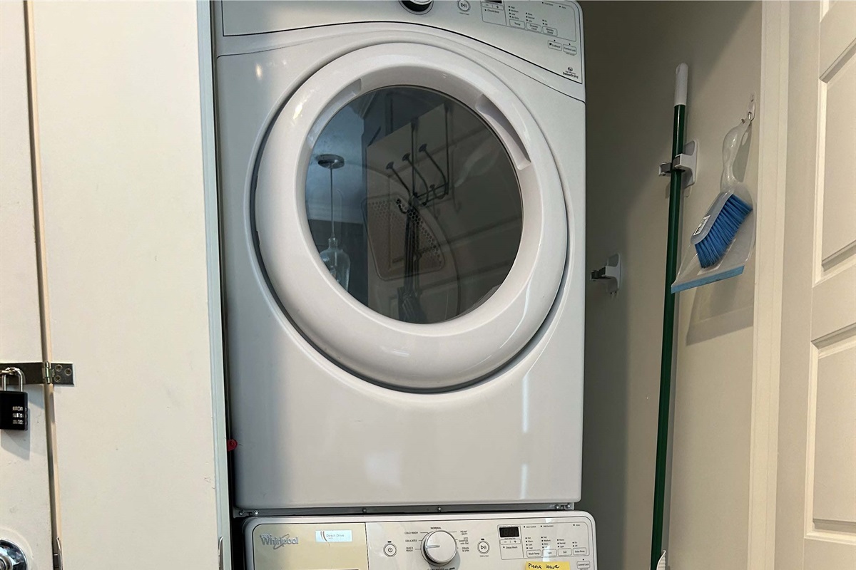 Washer & dryer, located in kitchen closet.