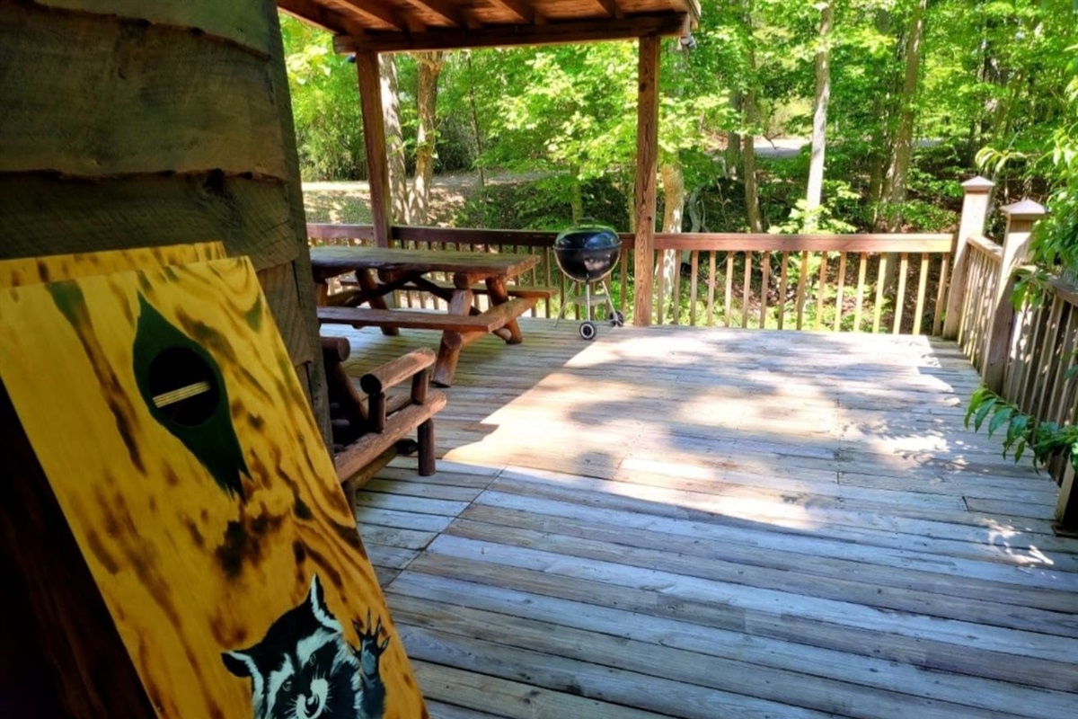 Large wrap round , fully enclosed deck with corn hole game