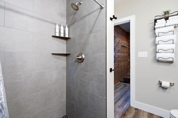 Refresh in a spacious walk-in shower with clean, modern finishes.