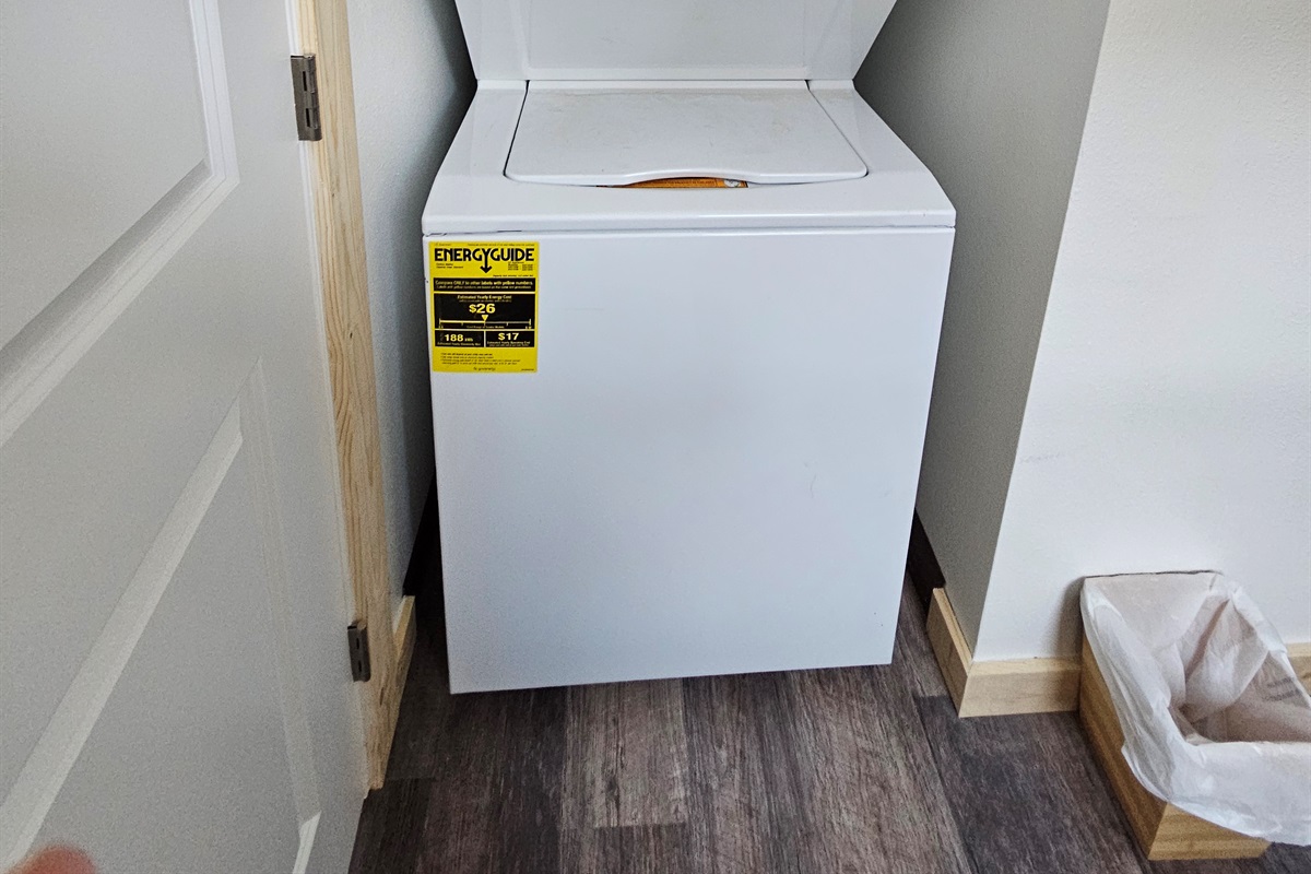 Washer and dryer located behind the door in the bathroom.