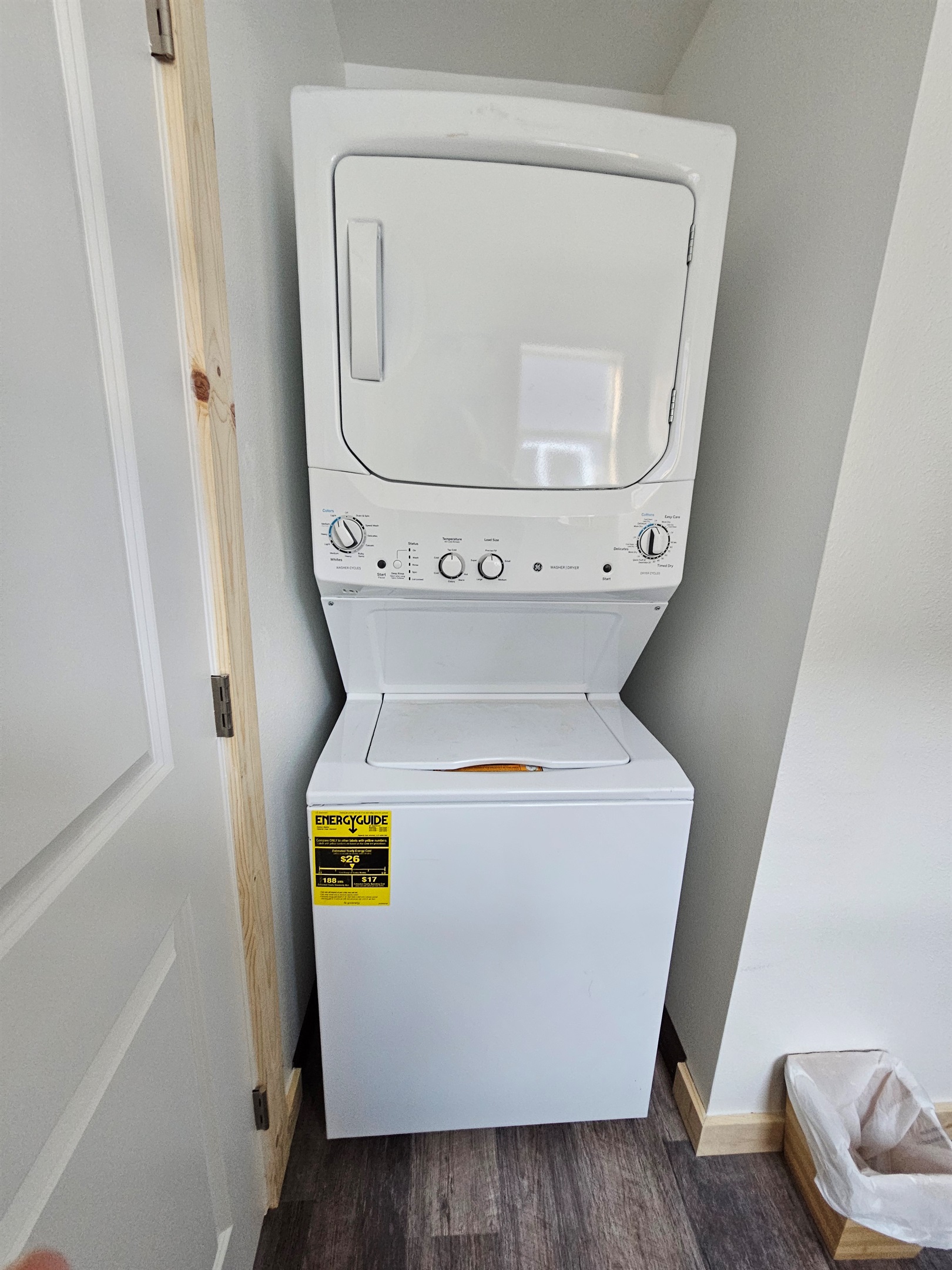 Washer and dryer located behind the door in the bathroom.