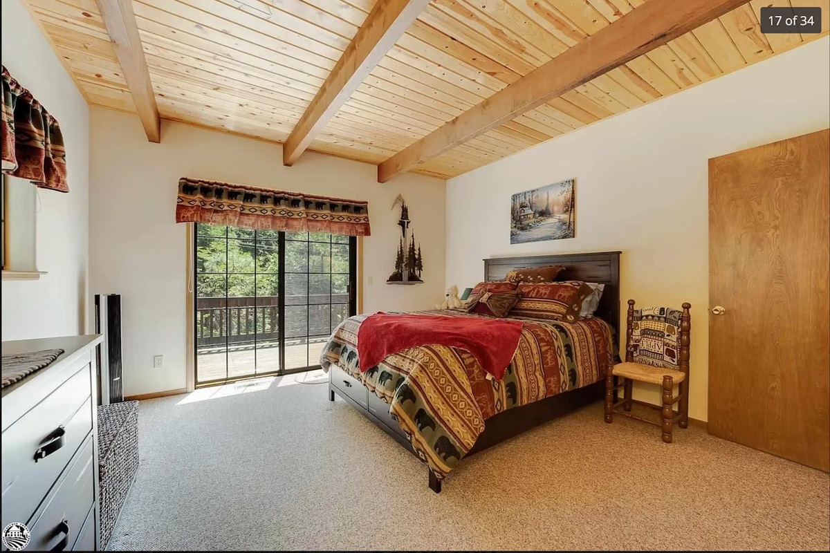 Downstairs bedroom #1 with access to deck. Queen Bed